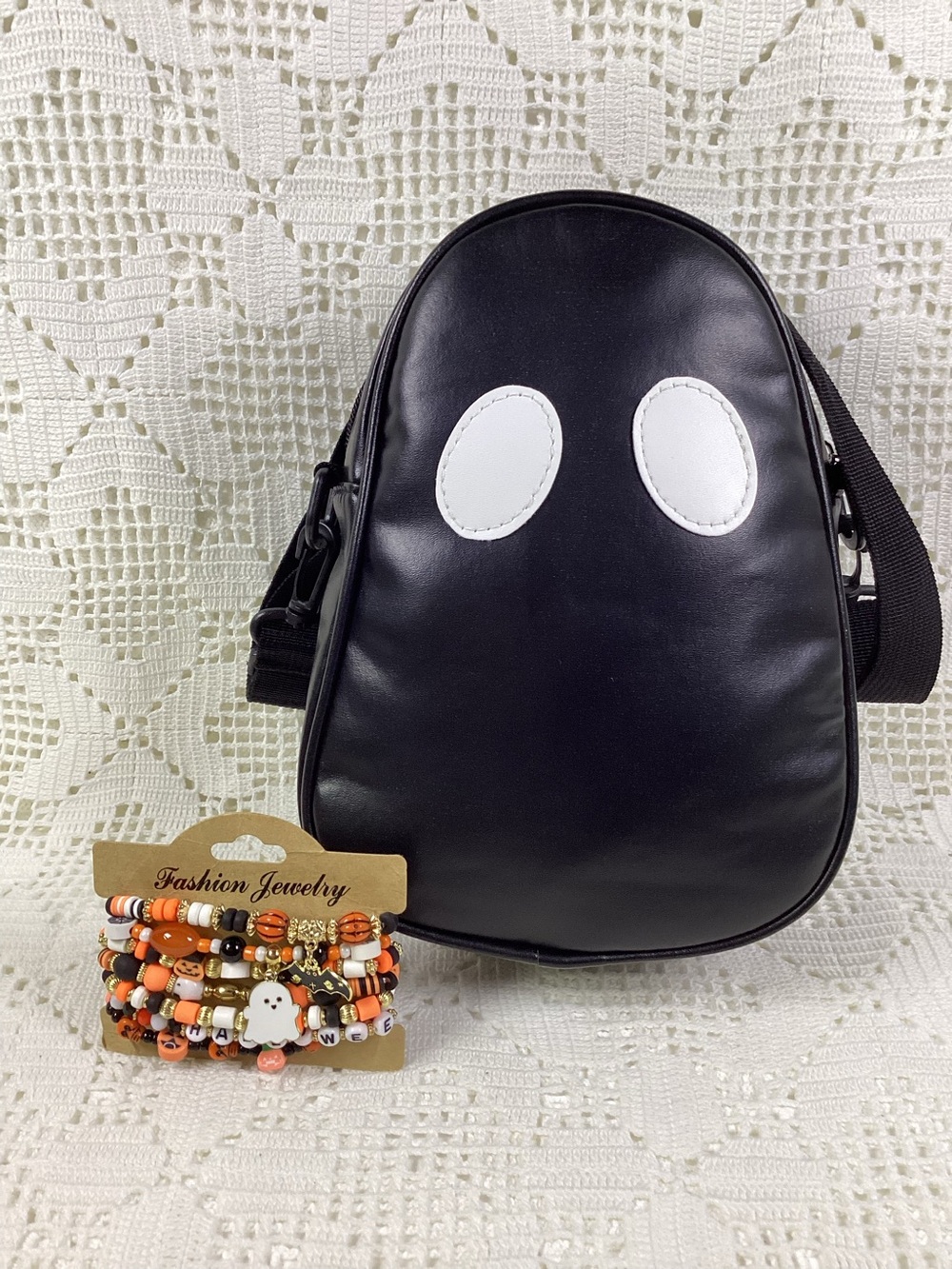Black Ghost Crossbody Bag with White Eyes & set of 7 beaded bracelets